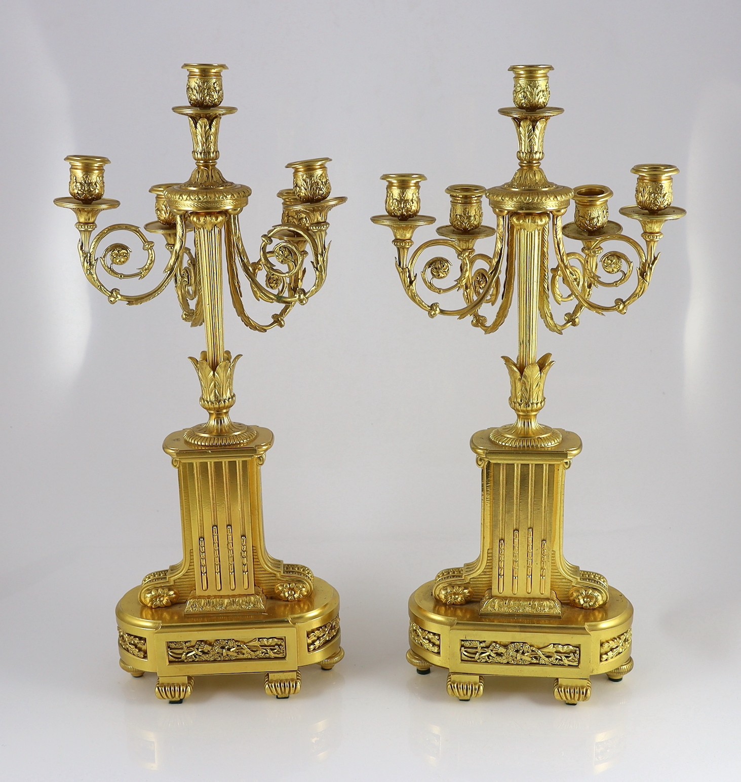 A pair of 19th century French ormolu five light candelabra, 26cm wide, 56cm high